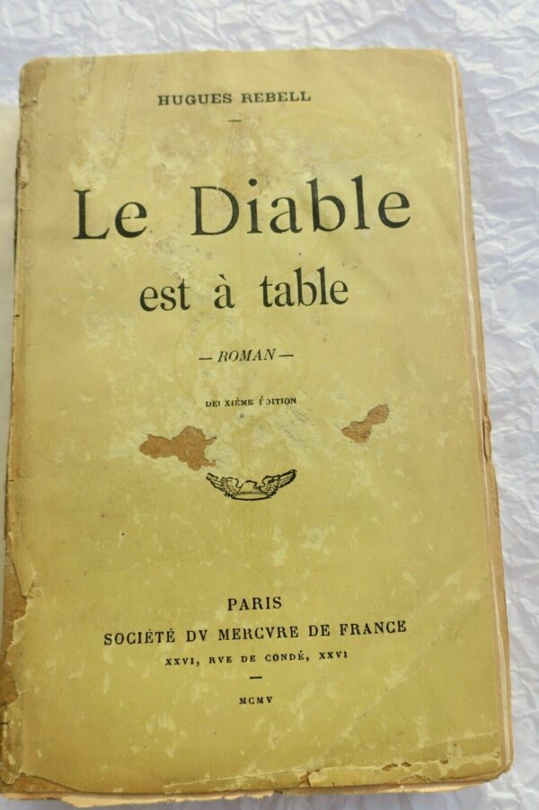 REBELL, Hugues. Le Diable est à table